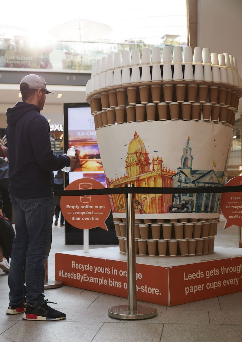 Photo of exhibition showing how many single use coffee cups we use in Leeds